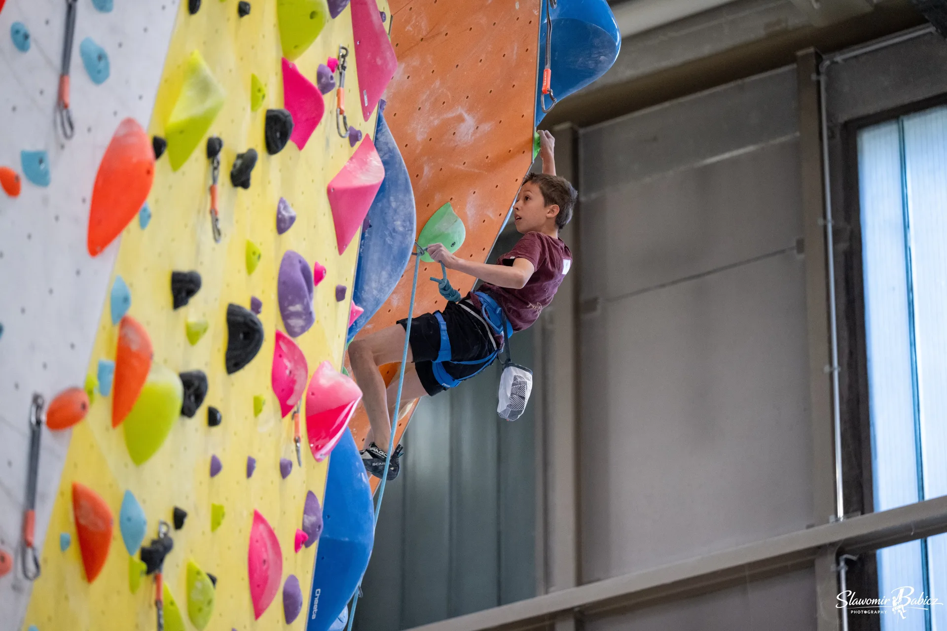 Rock climber ascending a steep face